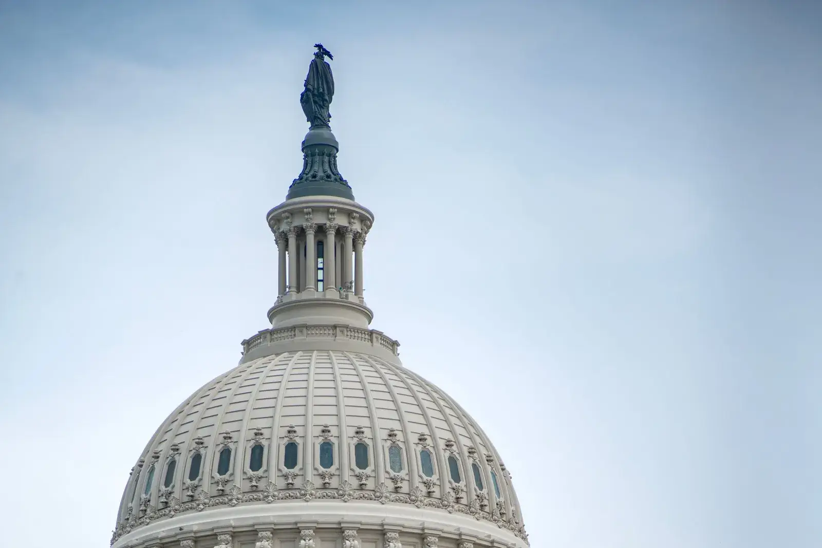 The dome of the United States Capitol under a clear sky